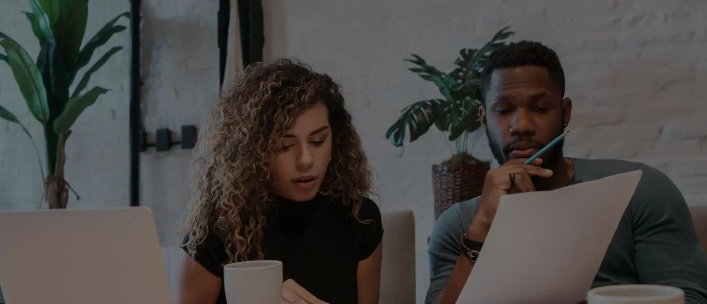 Homeowners reviewing renovation documents together