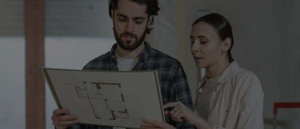 Homeowners reviewing bathroom renovation plans together